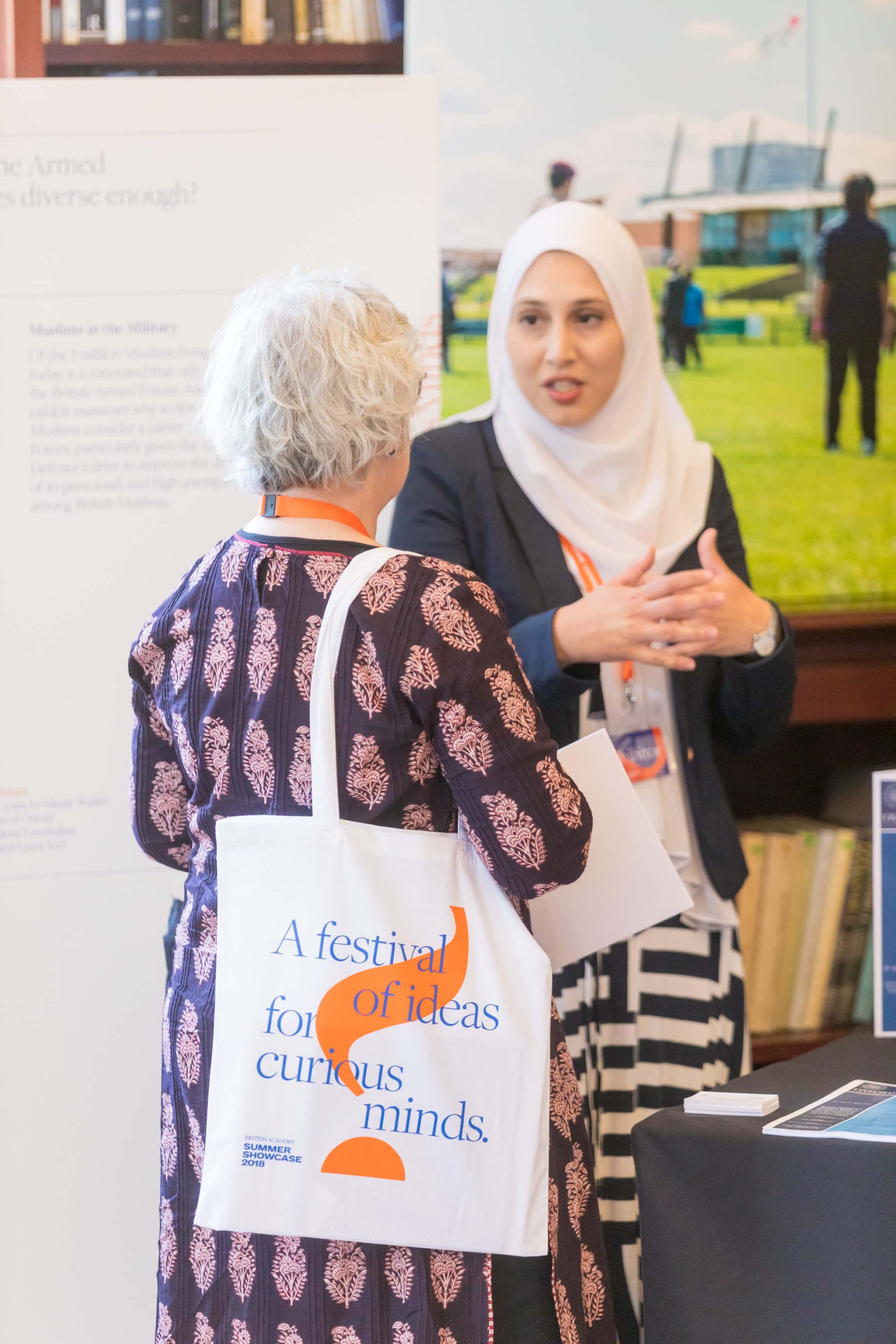 Asma talking to woman